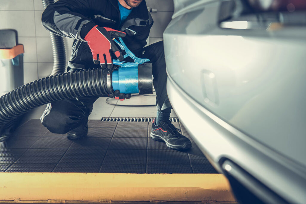 Maintenance Inside the Auto Service Building. Automotive Equipment for emissions test